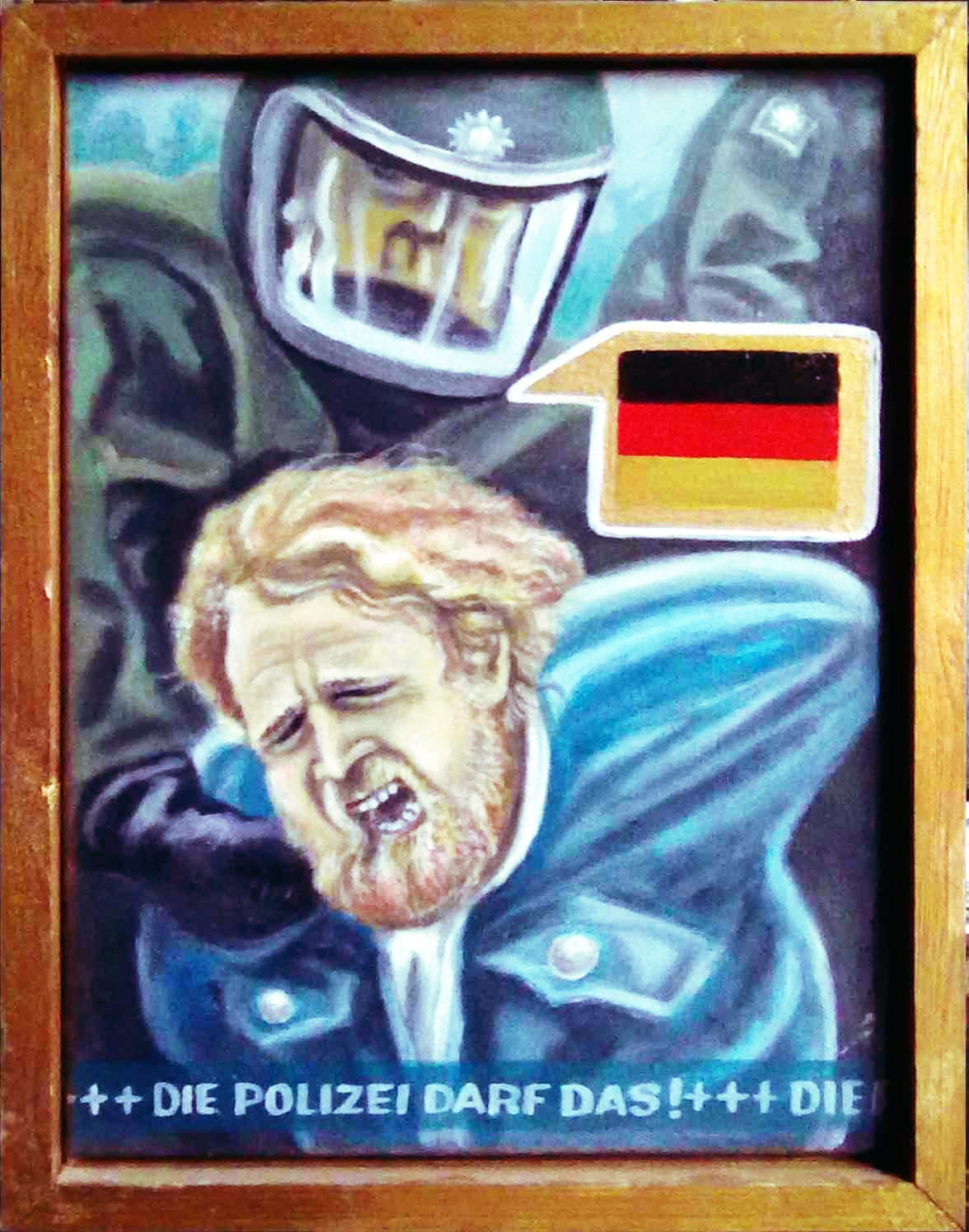 Ein Demonstrant im Schmerzgriff eines Polizisten.